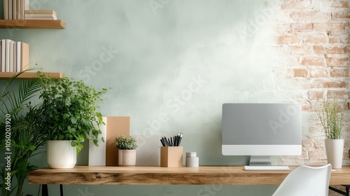 A minimalist workspace features a sleek computer, potted plants, and stationery on a rustic wooden desk against a textured wall, fostering creativity and focus. photo