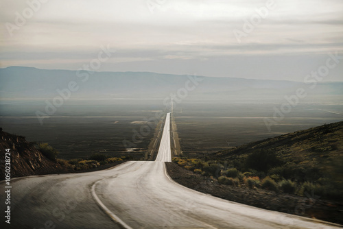 Highway stretching into the distance in the rays of the evening sun.