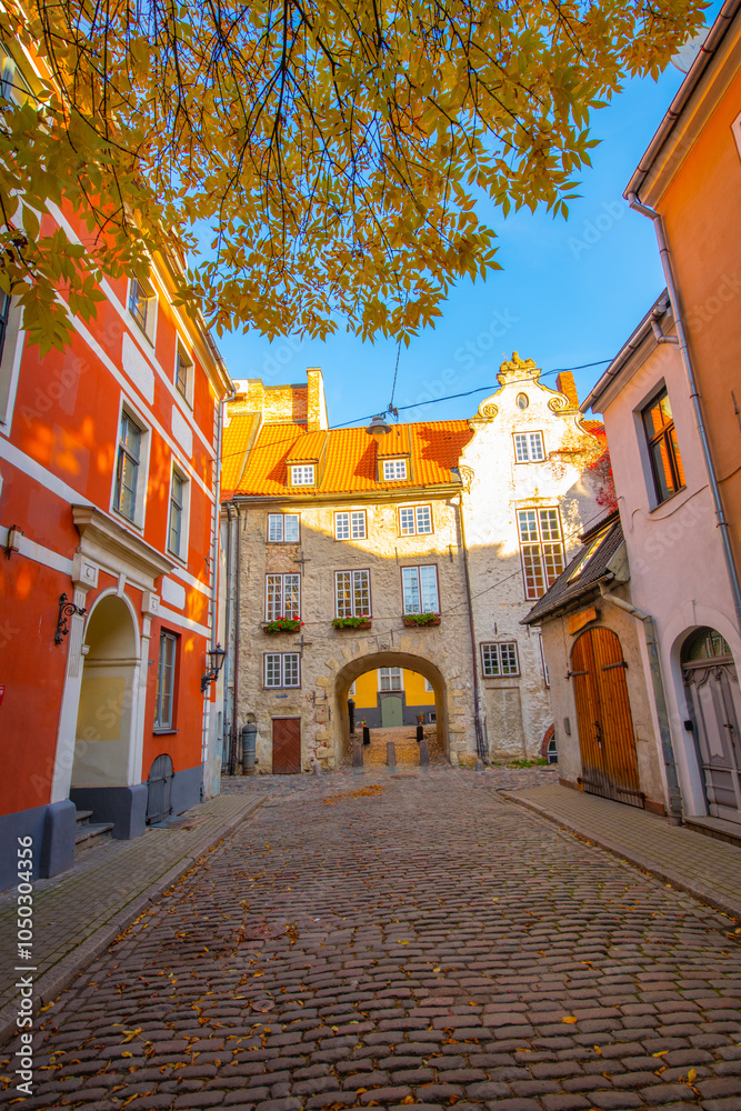 Obraz premium Old street in old Riga. The city is capital of Latvia that is well known to be a very popular tourism destination in the Baltic region