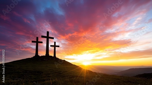Dramatic sunset sky with three crosses silhouetted on a hilltop vibrant reds oranges and purples filling the sky creating a scene of solemn beauty and reflection