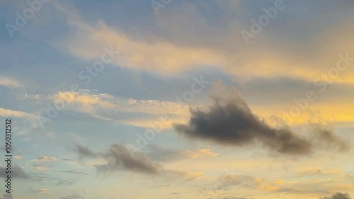 View of the twilight blue sky covered with cumulus clouds with dramatic light. Beautiful sky with clouds panoramic sunset with golden orange clouds beautiful and amazing.