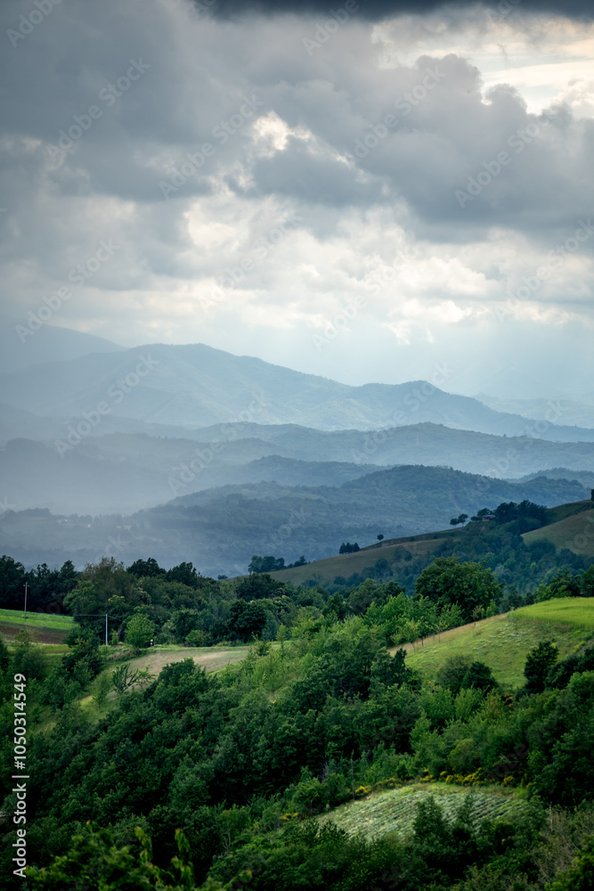 Naklejka premium Rainy landscape and mountains in the background