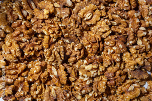 Scattered Shelled Walnuts. Background from Walnut. Natural High-Calorie Snacks photo