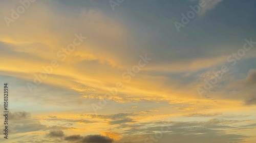 View of the twilight blue sky covered with cumulus clouds with dramatic light. Beautiful sky with clouds panoramic sunset with golden orange clouds beautiful and amazing.