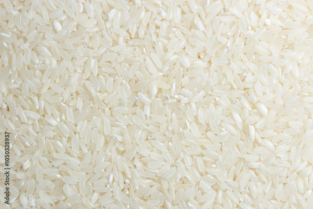 Dry Uncooked White Rice Background - Top View, Flat Lay. Scattered Raw Long Grain Rice. Asian Cuisine and Culture. Healthy Eating Ingredients. Diet Food Dry Uncooked White Rice Background - Top View, Flat Lay. Scattered Raw Long Grain Rice. Asian Cuisine and Culture. Healthy Eating Ingredients. Diet Food