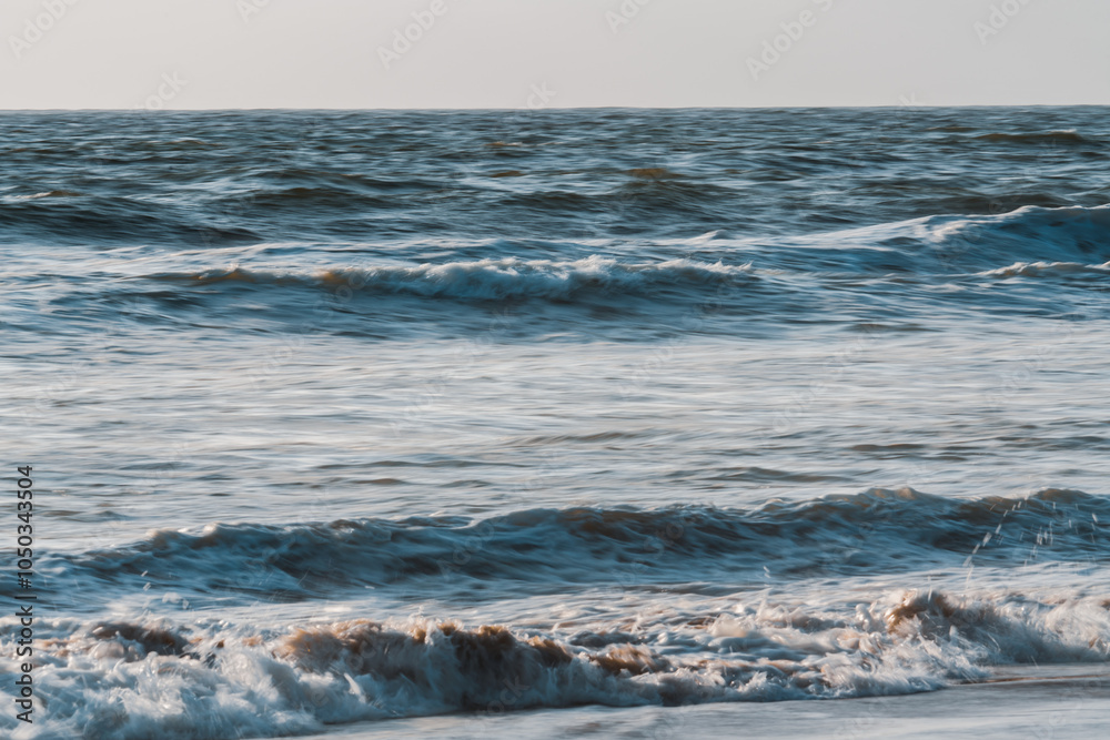 Dramatic seascape, abstract. Stormy Pacific ocean, and clear sky in the background, motion blur Dramatic seascape, abstract. Stormy Pacific ocean, and clear sky in the background, motion blur