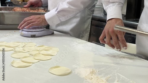 Motion of people are kneading the dough and shaping it with their hands to make dumplings in Taipei Taiwan with 4k resolution.