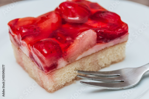 Portion of strawberry tart on a plate photo