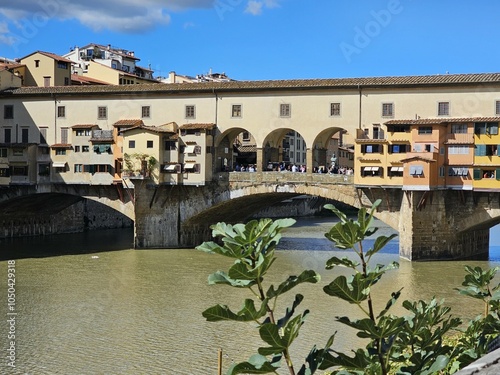 Florence, Italy - October 5, 2024: Discovering the city of Florence in autumn days. Frome the Duomo to Ponte Vecchio, old architecture covering the city. Beautiful sky reflected over Arno river.