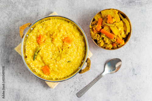 Khichdi is a comforting Indian dish made with rice, lentils, and mild spices, often served as a nourishing, easy-to-digest meal.