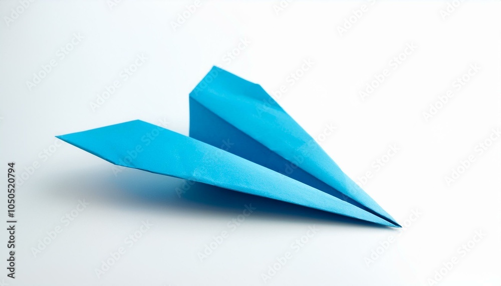 Blue paper airplane on white Blue paper airplane on white