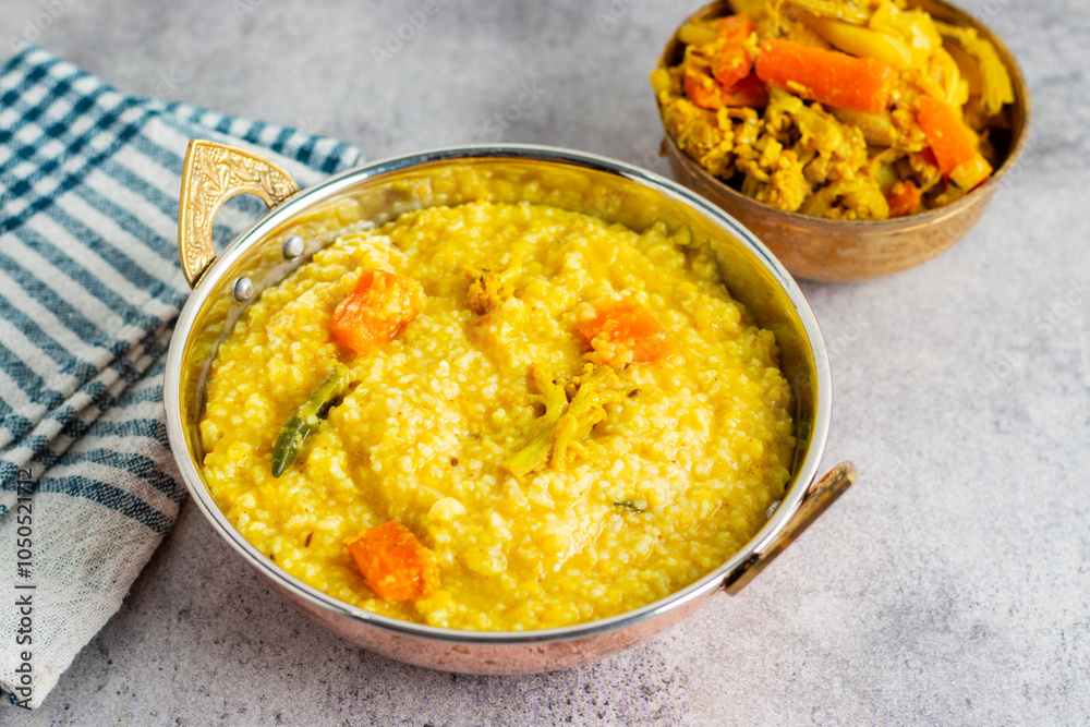 Khichdi is a comforting Indian dish made with rice, lentils, and mild spices, often served as a nourishing, easy-to-digest meal. Khichdi is a comforting Indian dish made with rice, lentils, and mild spices, often served as a nourishing, easy-to-digest meal.