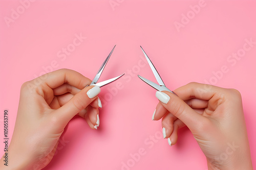 Cropped view of woman holding cuticle pusher and nippers isolated on pink, panoramic shot