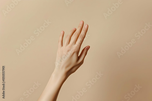 cropped view of female delicate hand isolated on beige