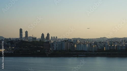city skyline at sunset with aircraft in Seoul city, Korea