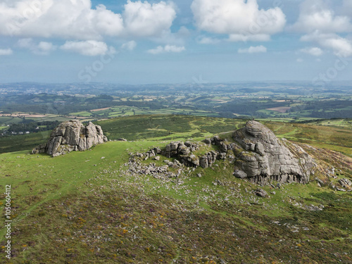 Haytor rock on Dartmoor in England. Panoramic picture showing the granite landmark taken in a Devonshire National park. photo