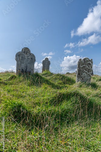 Afternoon sun shines down on the ancient church of St. Michael de Rupe in Brentor, Dartmoor photo