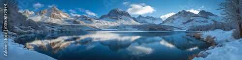 A beautiful snowy landscape with a lake in the middle