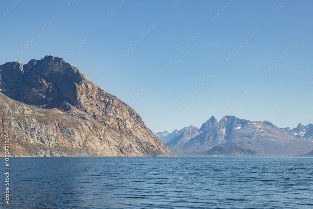 View of icebergs and mountains in the fjords of south Greenland View of icebergs and mountains in the fjords of south Greenland