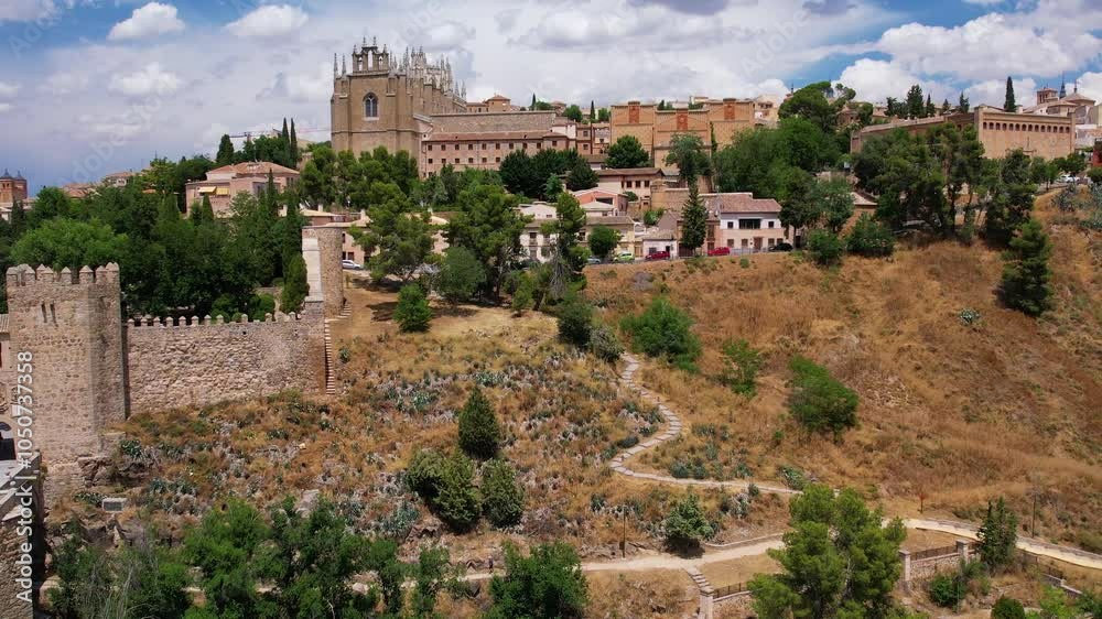Aerial view of Toledo. Historical medieval building with Monasterio de San Juan de los Reyes and San Martin's Bridge. Spain. Europe Aerial view of Toledo. Historical medieval building with Monasterio de San Juan de los Reyes and San Martin's Bridge. Spain. Europe