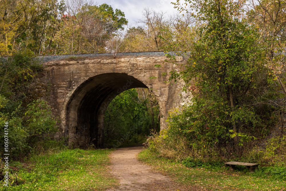 Hiking Trail Through A Railroad Arch Bridge In Autumn Hiking Trail Through A Railroad Arch Bridge In Autumn