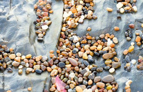 Horizontal, pebbles and tafoni photo