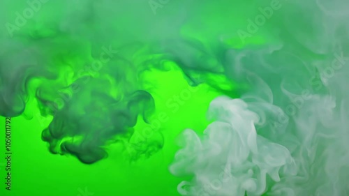 Dense green smoke cloud expanding and shifting in a vibrant green background, creating a captivating and atmospheric effect. video