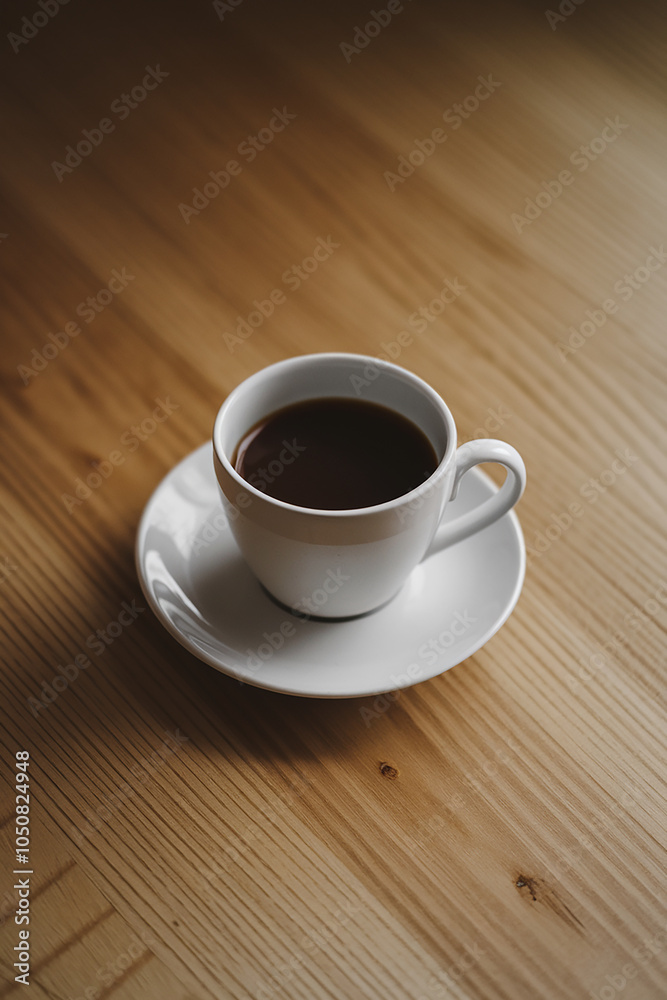 Cup of coffee on a wooden table Cup of coffee on a wooden table