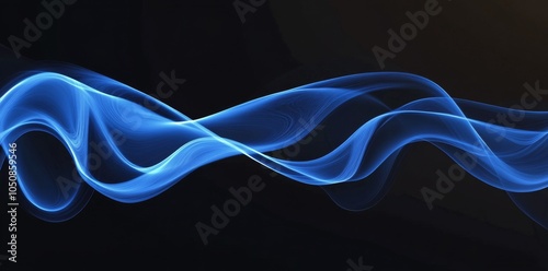 Blue flowing waves of smoke gracefully undulating against a black background