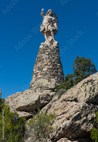 The statue of St. Michael the Archangel on Monte Idolo in the Santa Barbara Nature Park (Parco Naturale Santa Barbara), Sardinia photo