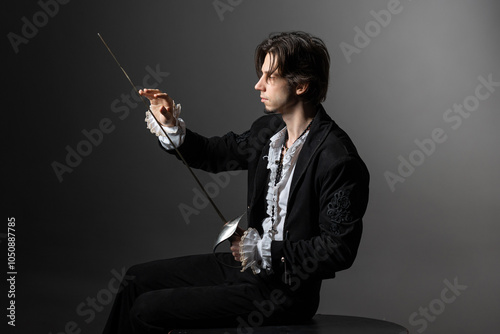 The romantic hero is a duelist in a medieval costume, the style of classical theatrical productions