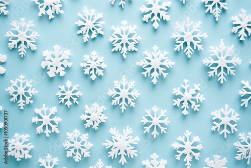 White snowflakes intricately scattered across a vibrant blue background, evoking a wintery atmosphere.