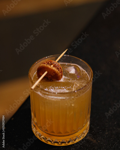 Glass filled with liquid and ice photo