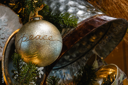 peace Christmas tree ornament on a tree with selective focus