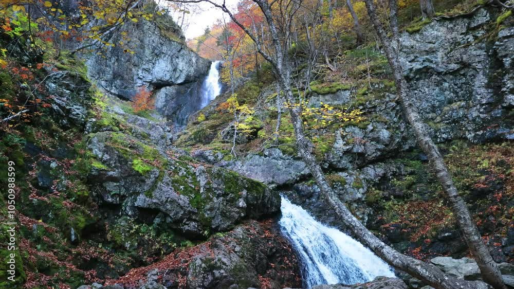 Uisge Ban Falls, Cape Breton, Nova Scotia, Canada. Cascading waterfalls with stunning autumn fall foliage colors. Uisge Ban Falls, Cape Breton, Nova Scotia, Canada. Cascading waterfalls with stunning autumn fall foliage colors.