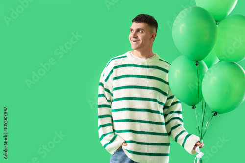 Young man with bunch of bal...