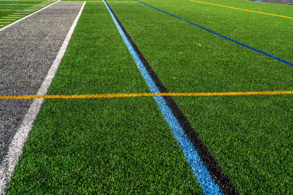 Fototapeta premium Image of a sideline on a multi-use synthetic turf field with multiple sports. 