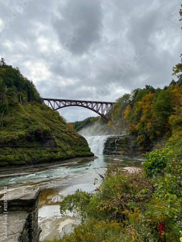 old bridge over the river fall foliage with waterfall New York photo