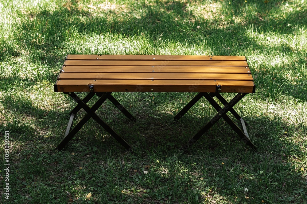 Wooden Folding Table on Green Grass Outdoor Picnic Table Camping Furniture Wooden Folding Table on Green Grass Outdoor Picnic Table Camping Furniture