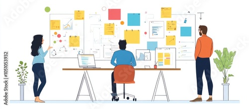A team of three people working together in an office, with one person standing and looking at a whiteboard with many sticky notes and charts. The other two are working at a desk.