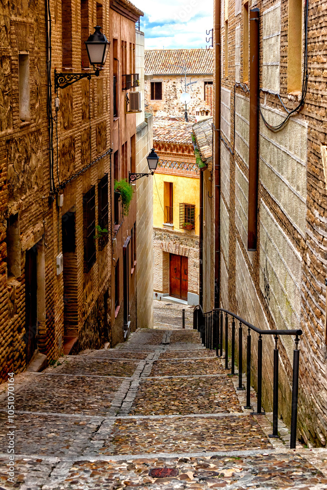 Fototapeta premium Steep, narrow street in Toledo, Spain