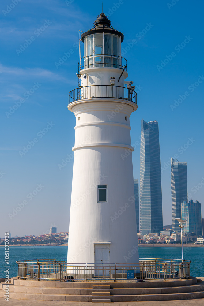 The lighthouse and skyscrapers in Qingdao, Shandong, China The lighthouse and skyscrapers in Qingdao, Shandong, China