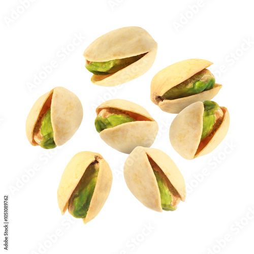 Tasty pistachios in air on white background