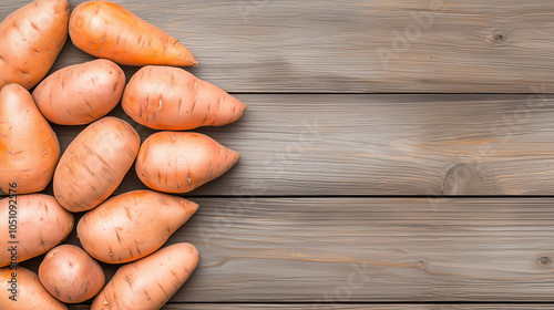 Rustic Harvest: A symphony of freshly harvested sweet potatoes, arranged in a delightful display on a weathered wooden surface,  captures the essence of autumnal abundance and natural goodness.  