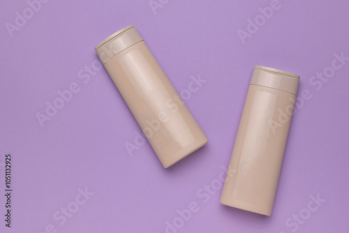 Minimalist Beige Shampoo Bottles on Pastel Purple Background for Beauty and Skincare Concepts