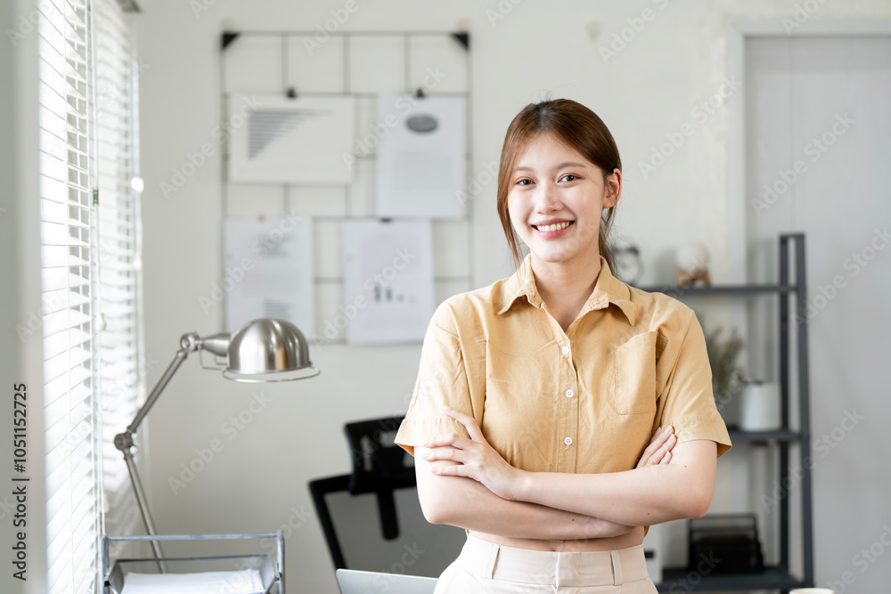 Portrait of beautiful young business woman standing while smiling looking at camera in the home office Portrait of beautiful young business woman standing while smiling looking at camera in the home office