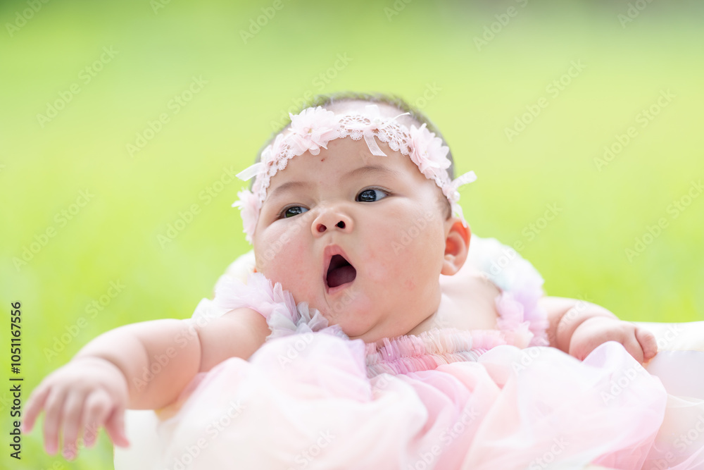 A Taiwanese couple in their 20s and their 7-month-old baby celebrate their anniversary in a vast green park in Yilan County, Taiwan.