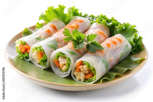 Vietnamese Goi Cuon spring rolls with rice noodles, shrimp, chicken, salad, wrapped in rice paper on plate cutout on white background photo