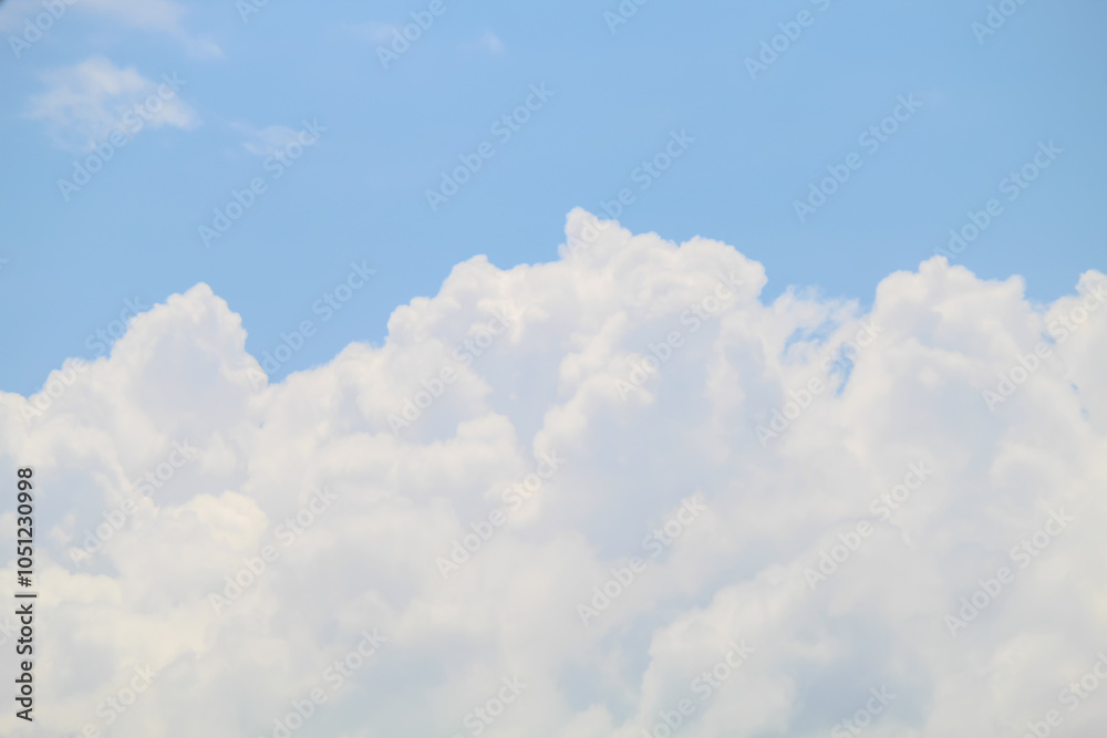 Naklejka premium The sky was bright blue with pure white clouds like soft cotton. Full frame shot. Cloudly sky blue sky background