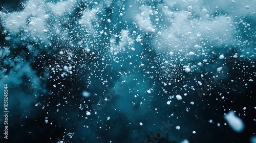 Beautiful falling snowflakes wallpaper. Winter dust ice particles. Snowfall weather white teal blue background. 